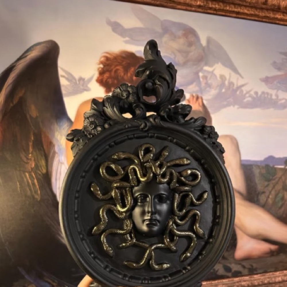 ornate plaster wall plaque with medusa (decorative